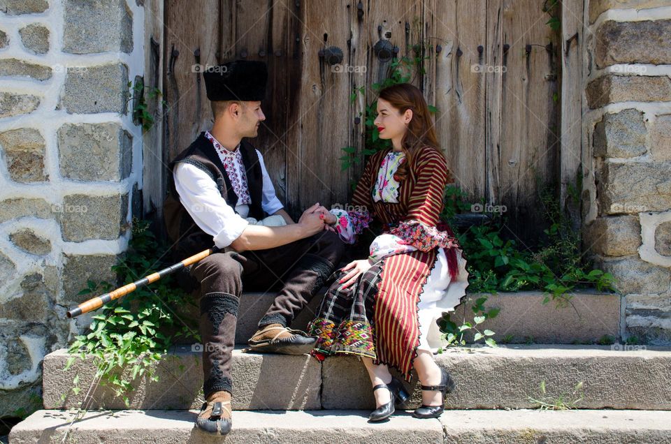 Tenderness Series:Beautiful Happy Couple Young Husband Wife, Dressed in Bulgarian Traditional Clothing (nosiya)