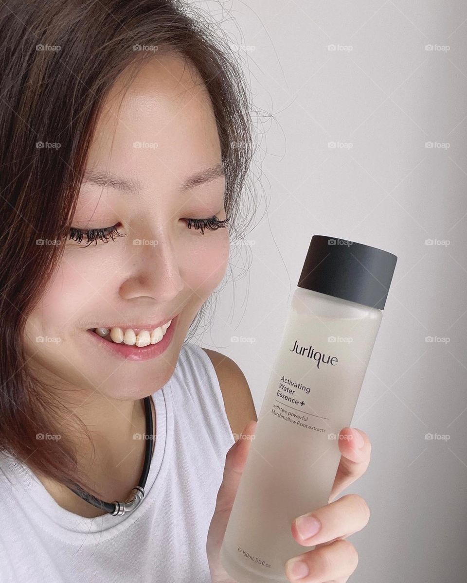 Asian woman with water essence for skin