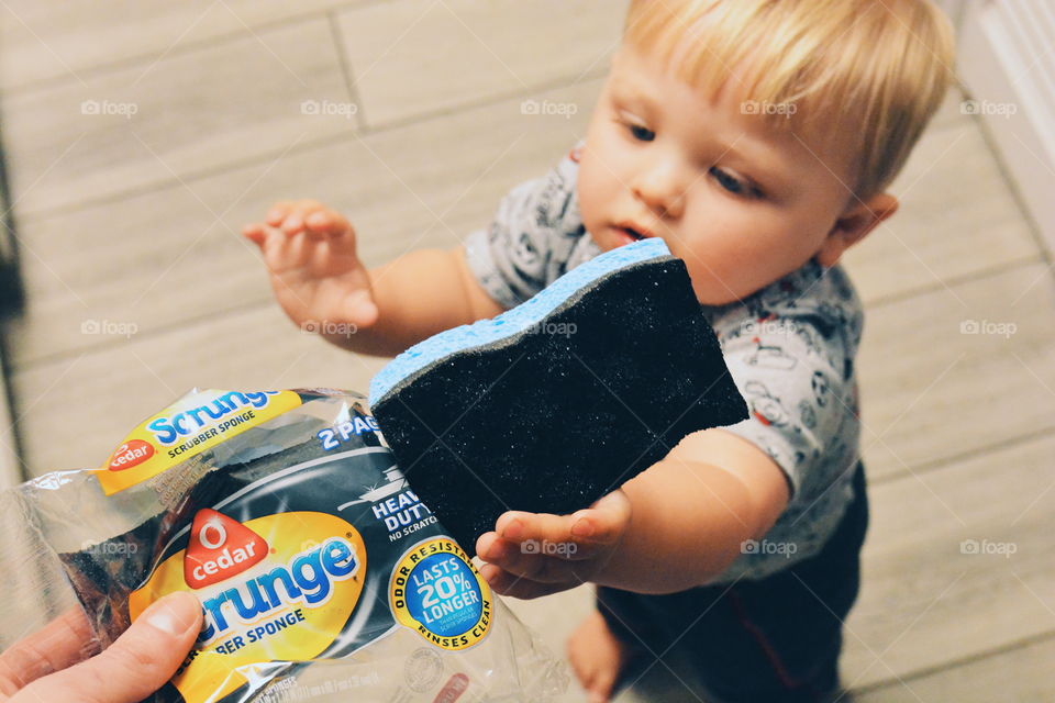 little boy cleaning
