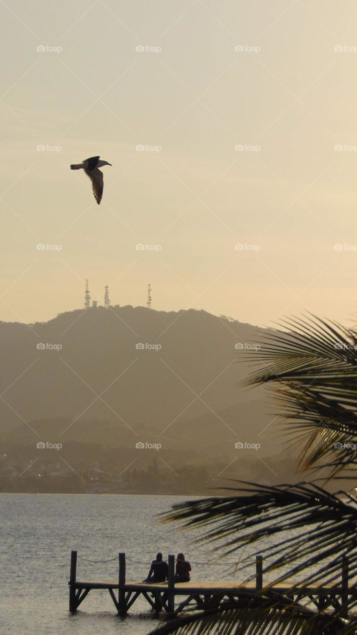 Couple sitting by the lake