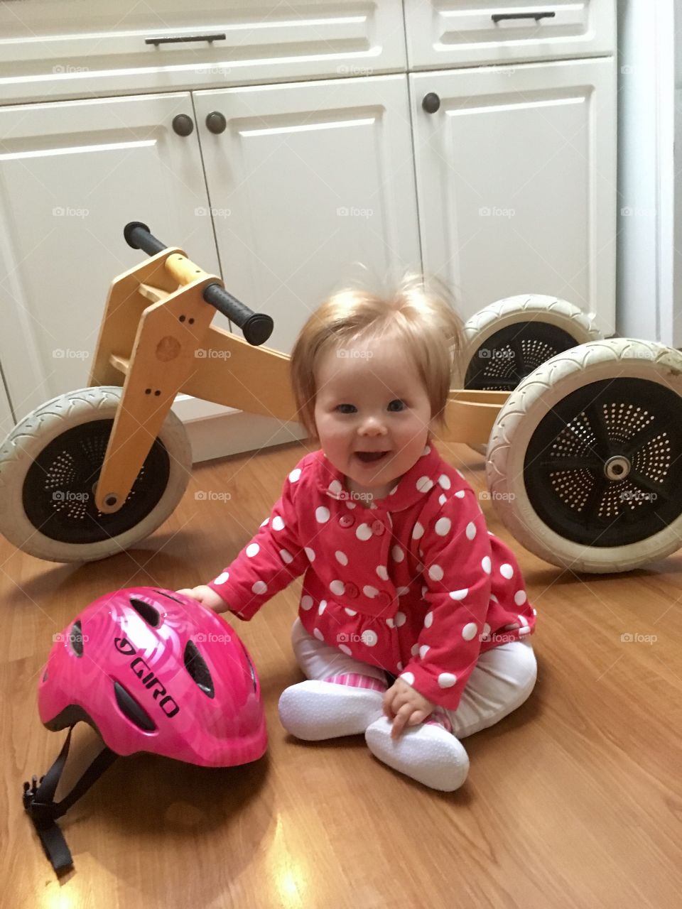 Baby with helmet and bike