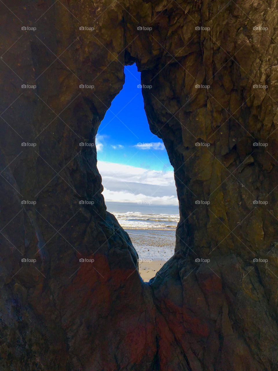 Scenic sea through cave