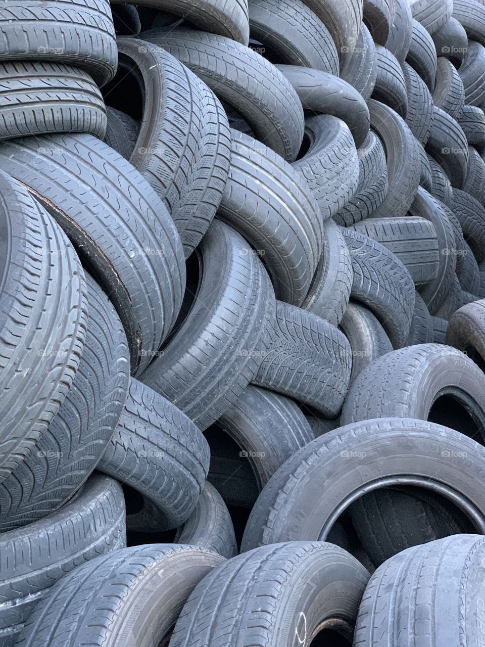 Used car wheels piled up