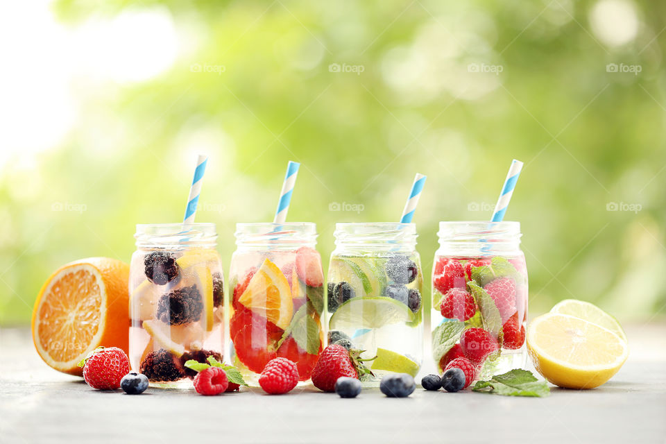 Summer photography. Fresh water with berries