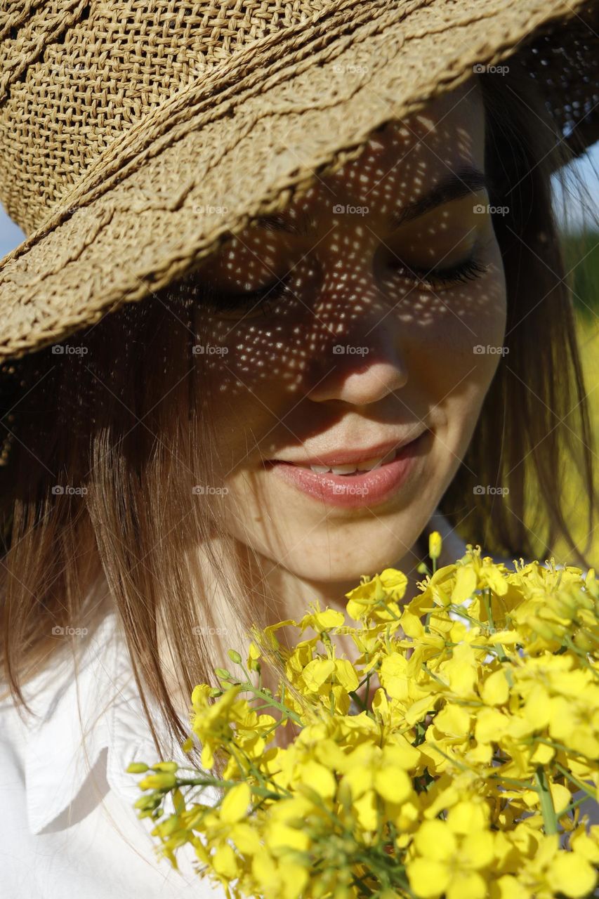 A girl smelling the flowers