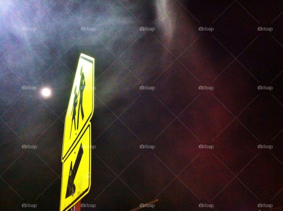 School crossing sign at dusk