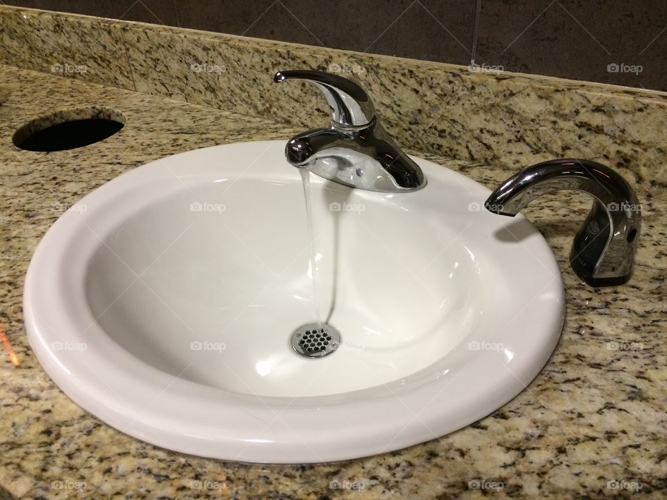 Bathroom sink running water