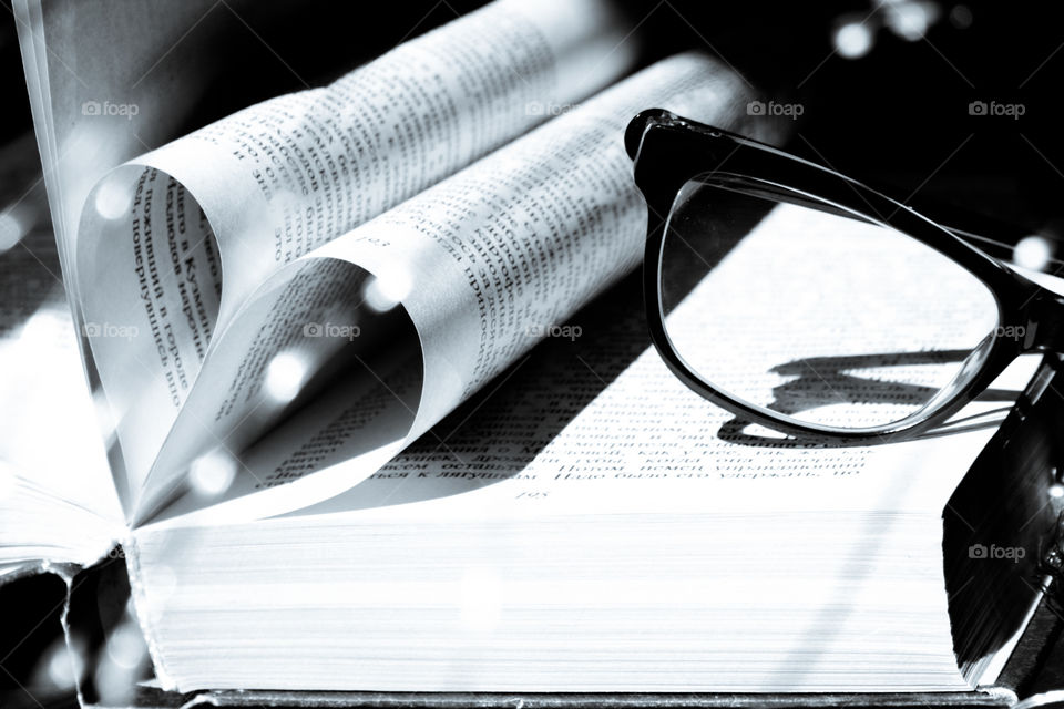 Book and glasses in black and white 