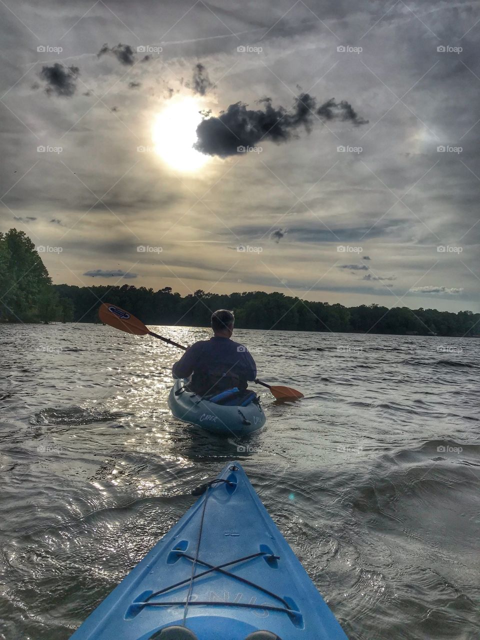 An evening paddle in a lake watching the sun set