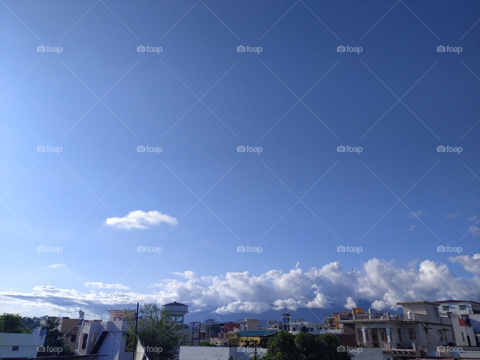 Pre monsoon clouds floating across the beautiful blue sky