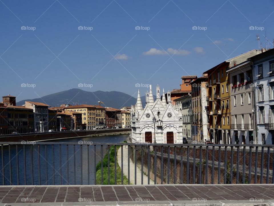 Beautiful architecture and scenery, Pisa Italy ... Pisa is not just the leaning tower . This is beautiful heavenly Pisa . Breathtaking, from the architecture of the buildings to the mountains, blue sky  and river  ... picture perfect :)