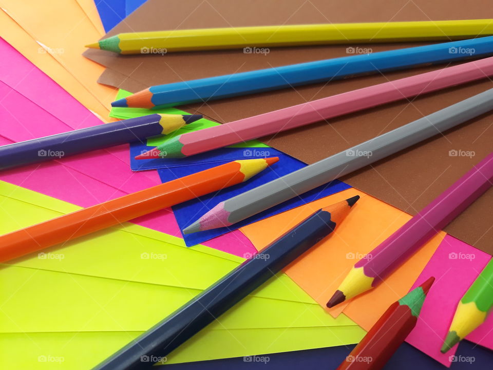 Colored pencils and leaves.