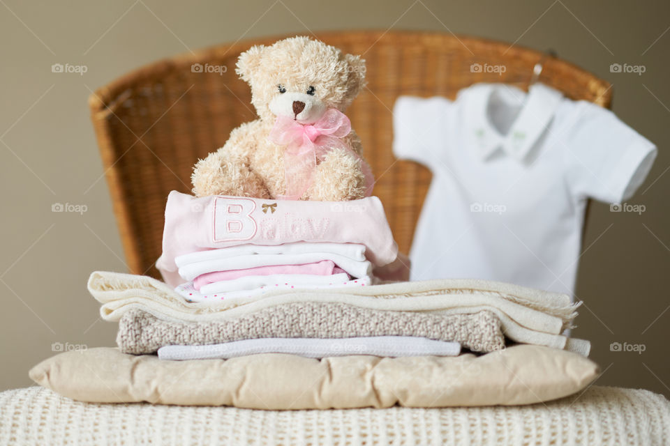 Stack of cloth with soft toy