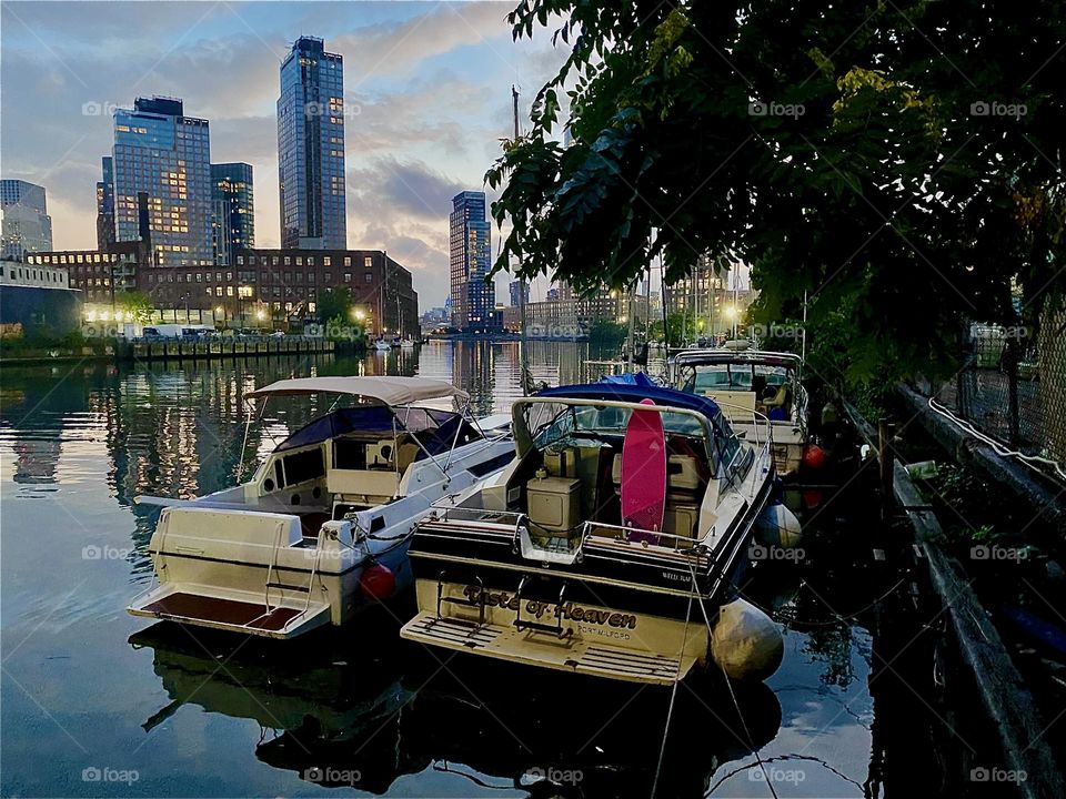 This is “Newtown Creek” by the “Pulaski Bridge” in LIC. Many different kinds of boats are tied to the shore here and at twilight time just before nightfall the ocean sometimes shimmers in a deep metallic shade of silver. 2023. Hypnotic Productions