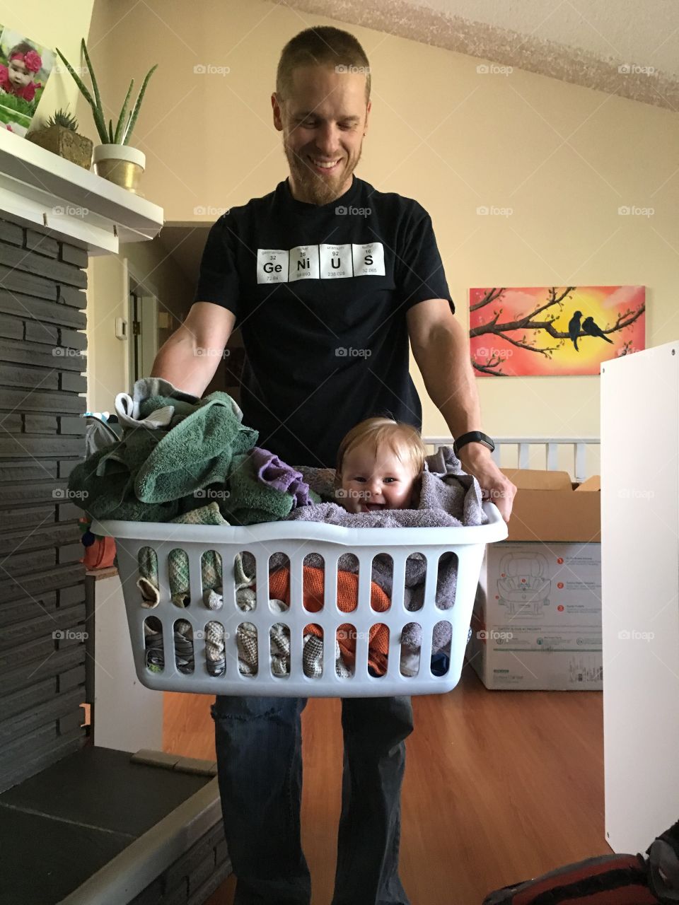 Baby in laundry basket 