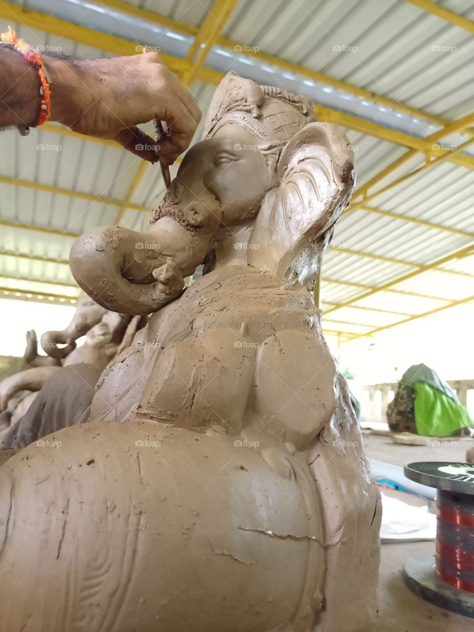 Indian artist is making an idol of God Ganesha for Ganesh festival in india