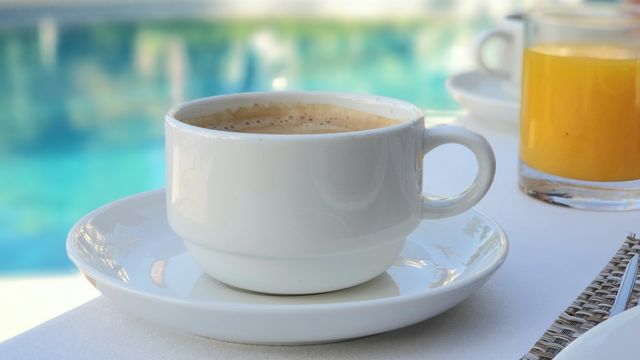 Morning ritual - having a big cup of caffe latte and a glass of fresh squeezed orange juice 