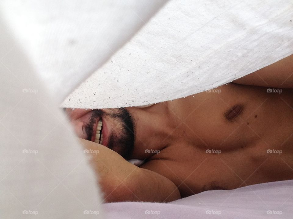 Human sleeping on bed