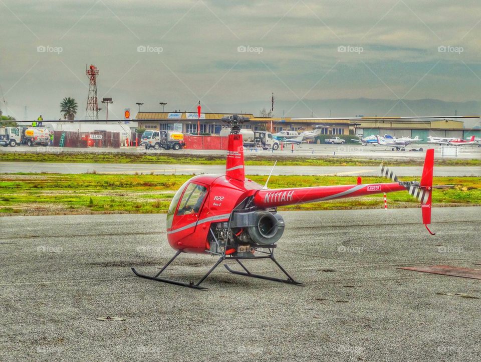 Helicopter Awaiting Flight. Robinson R-22 Helicopter On The Flightline
