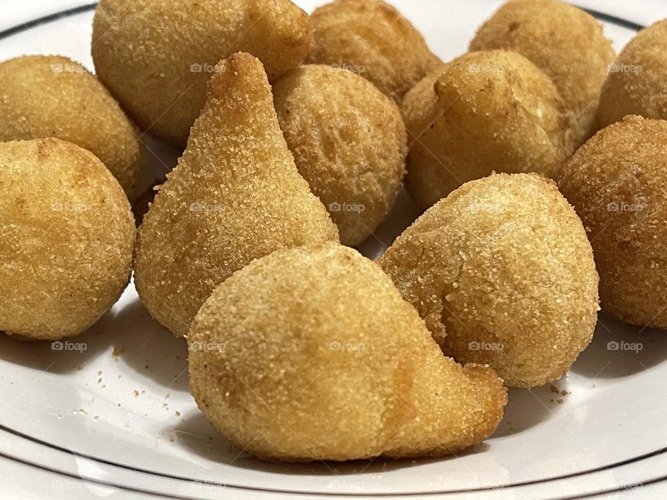 “Coxinha”: chopped or shredded chicken meat, covered in dough, molded into a shape resembling a teardrop, battered and fried. Delicious!