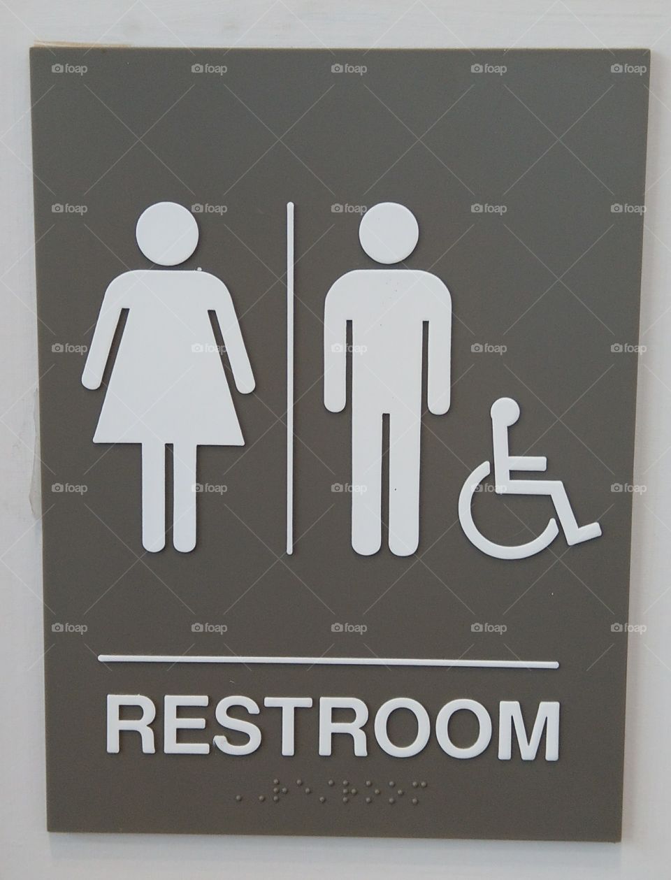 unisex handicap restroom sign