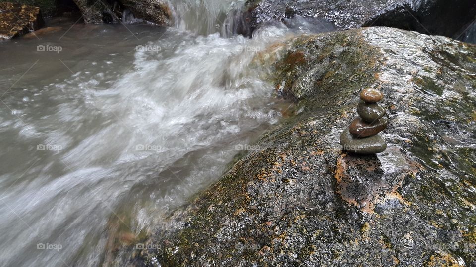 zen, stone pyramind balace by the river