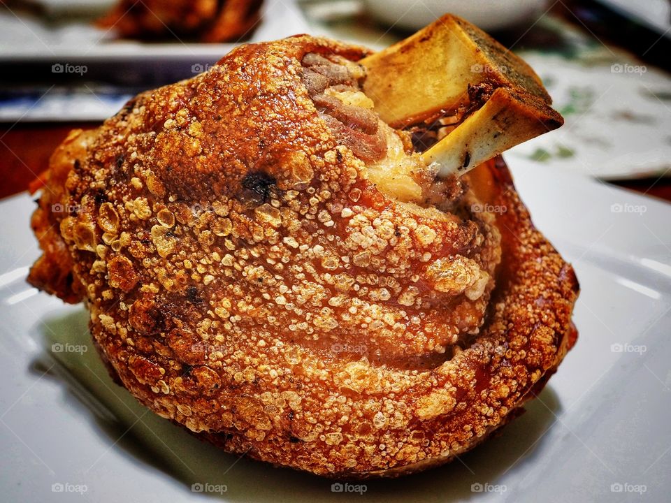 Pork hock (Schweinshaxe) roasted German-style. With crunchy and crispy skin. Also known as pork knuckle. Especially popular during Octoberfest.