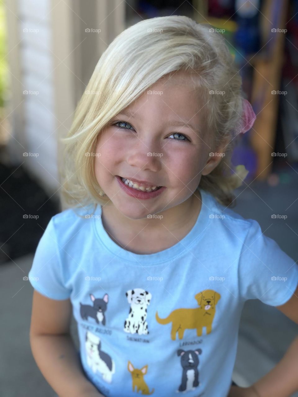 Adorable girl excited and loving her new haircut 