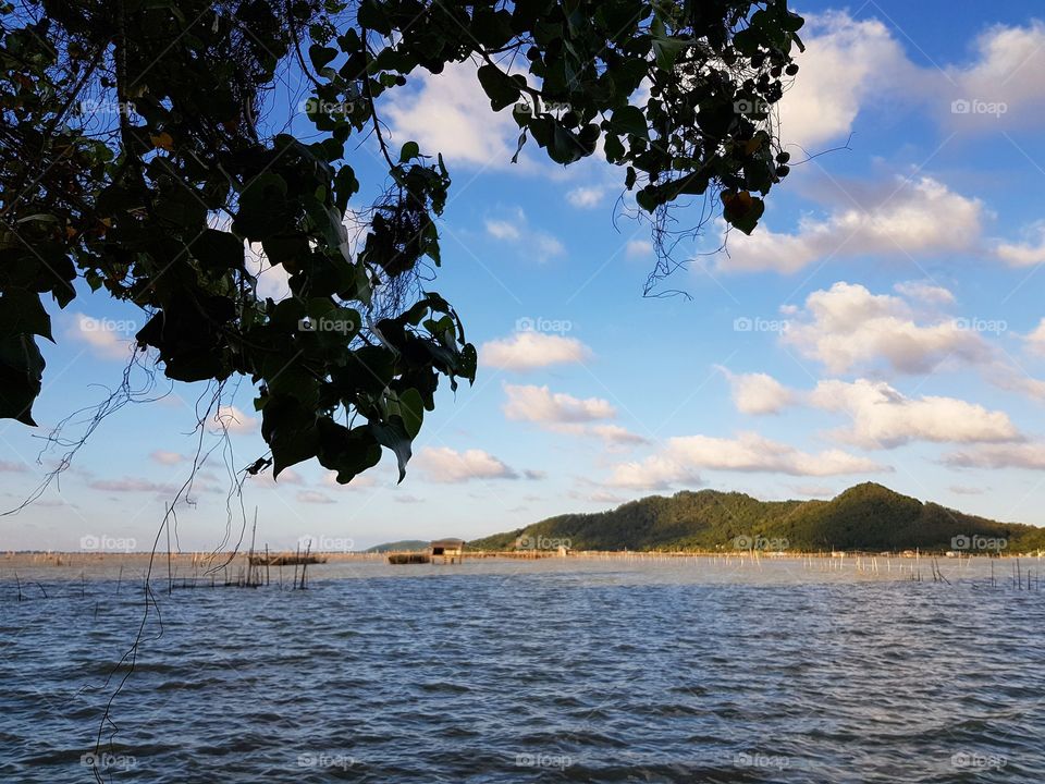 Scenic view of lake against blue sky