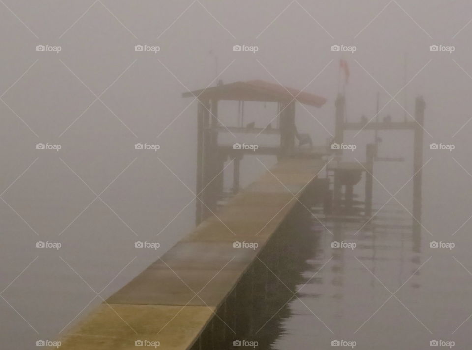 Dock extending into fog