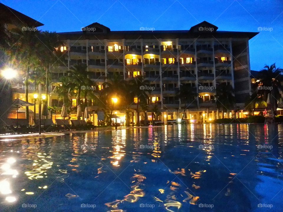 Pool area at night at Thistle Resort & Spa, Port Dickson, Malaysia