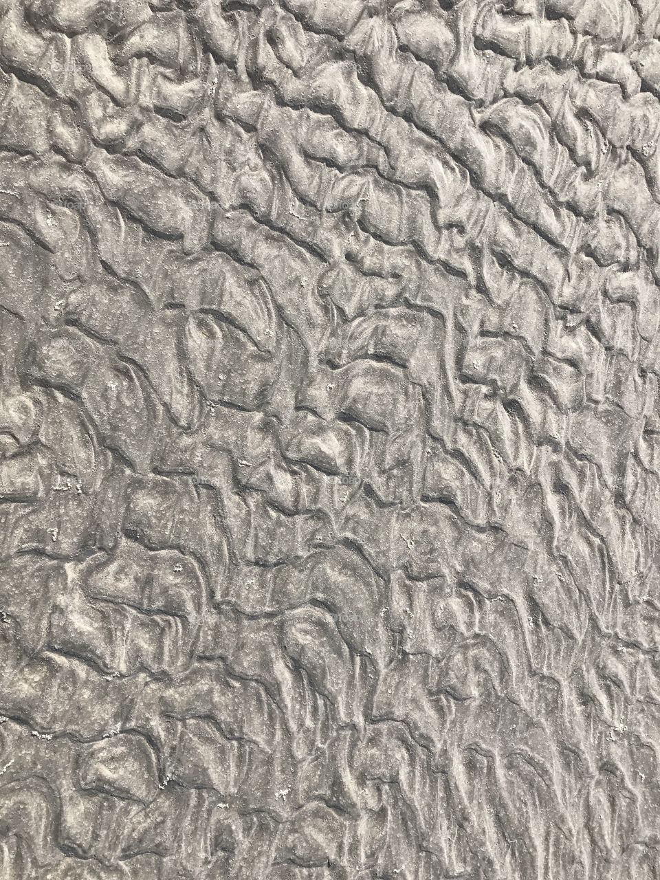 Close-up of rippled pattern on sand beach