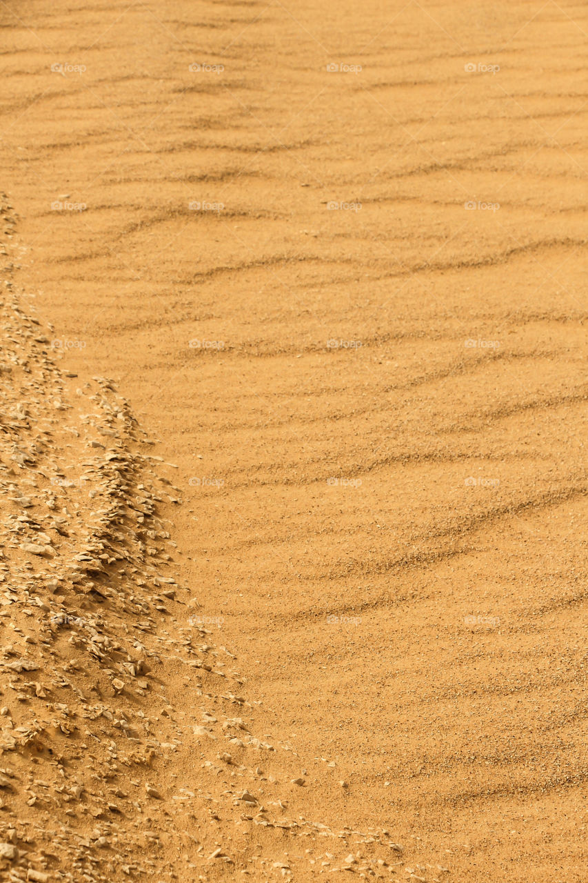 Full frame shot of brown sand