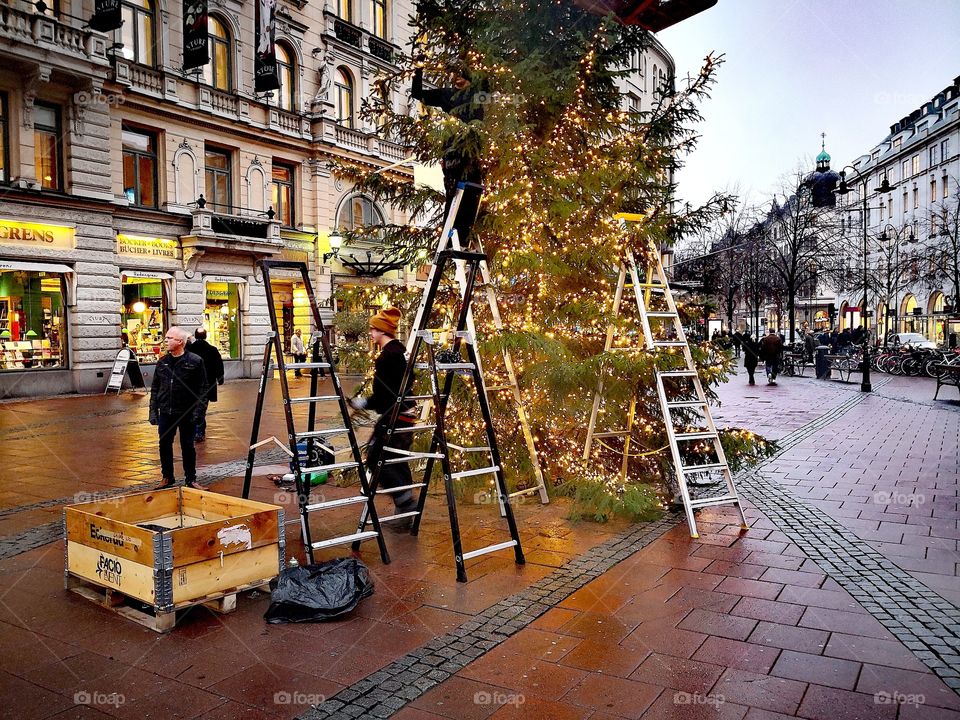 Setting up holiday decorations.