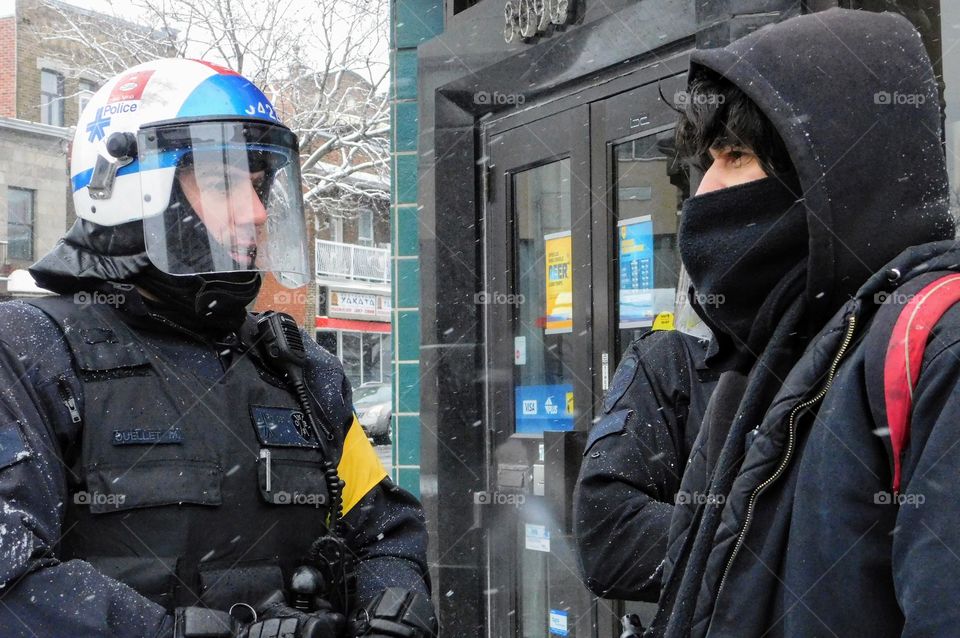 Police versus masked protester