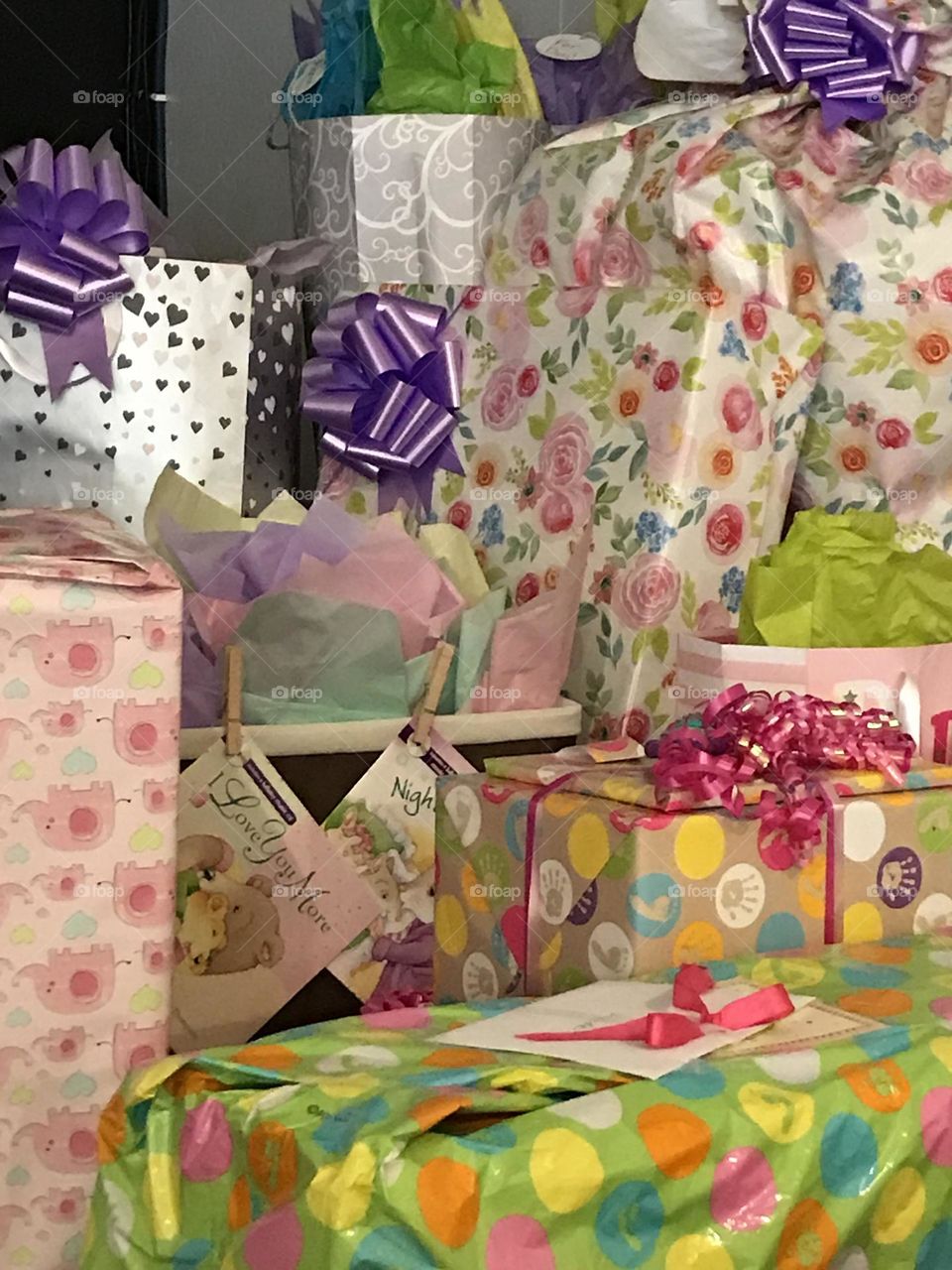 Pile of unopened gifts in pastel colors for a baby shower 