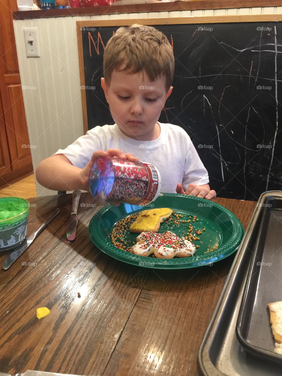 Mason helping bake Christmas cookies 