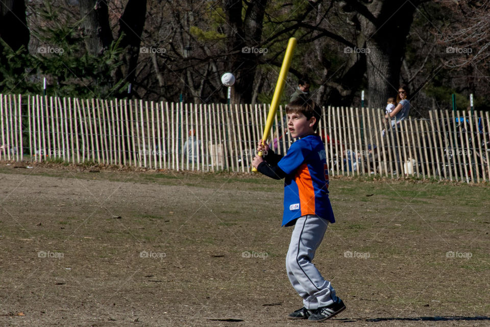 boy playing baseball