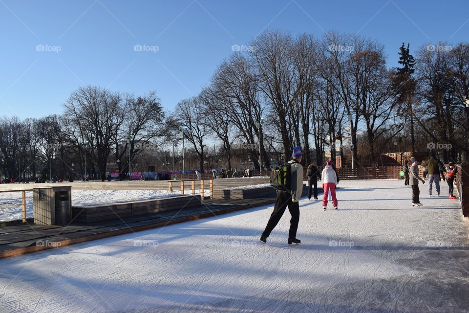 Winter in Russia. Ice skating in the park