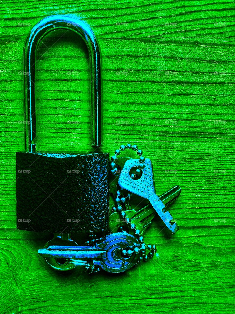Lock and keys wooden surface background 