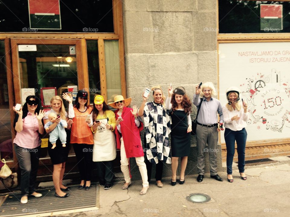 Masked people in front of bank