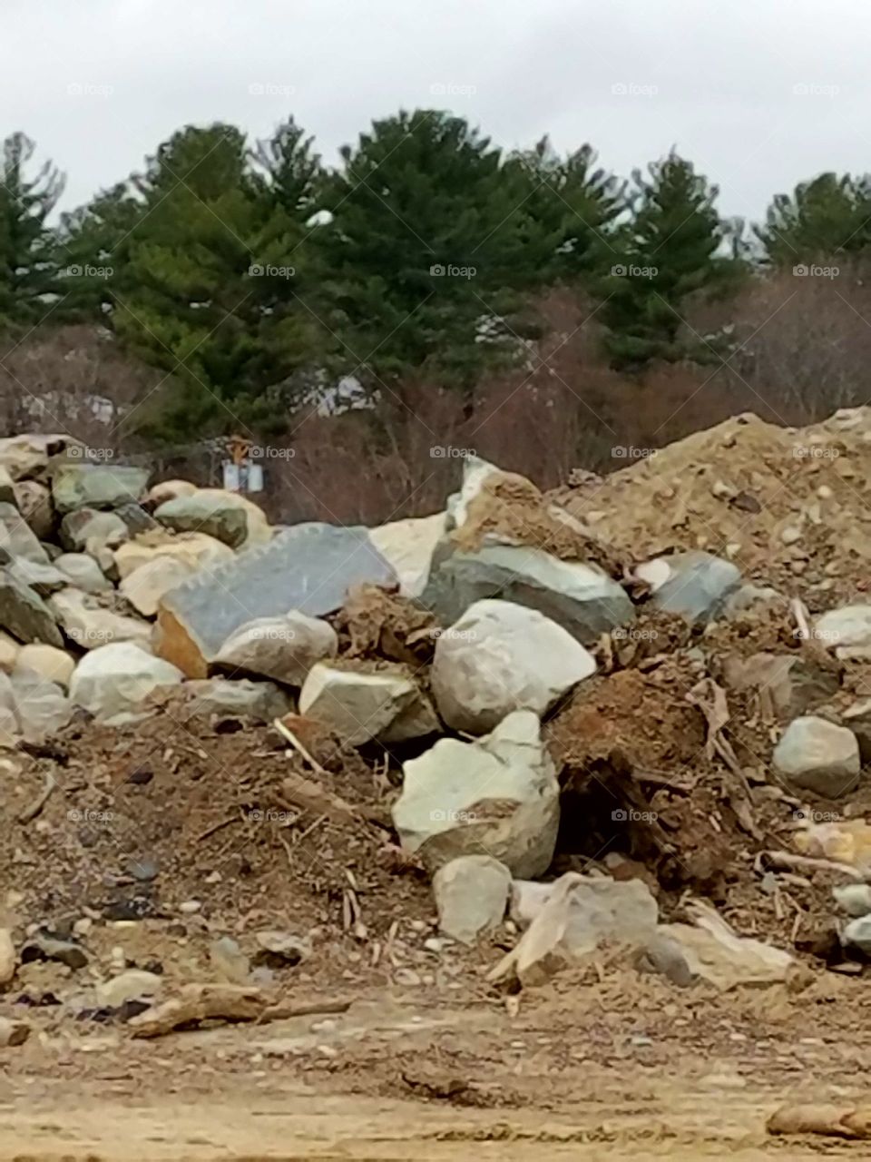 job site of land clearing for development. This pile of boulders & rocks was huge, I had to take this pic.
