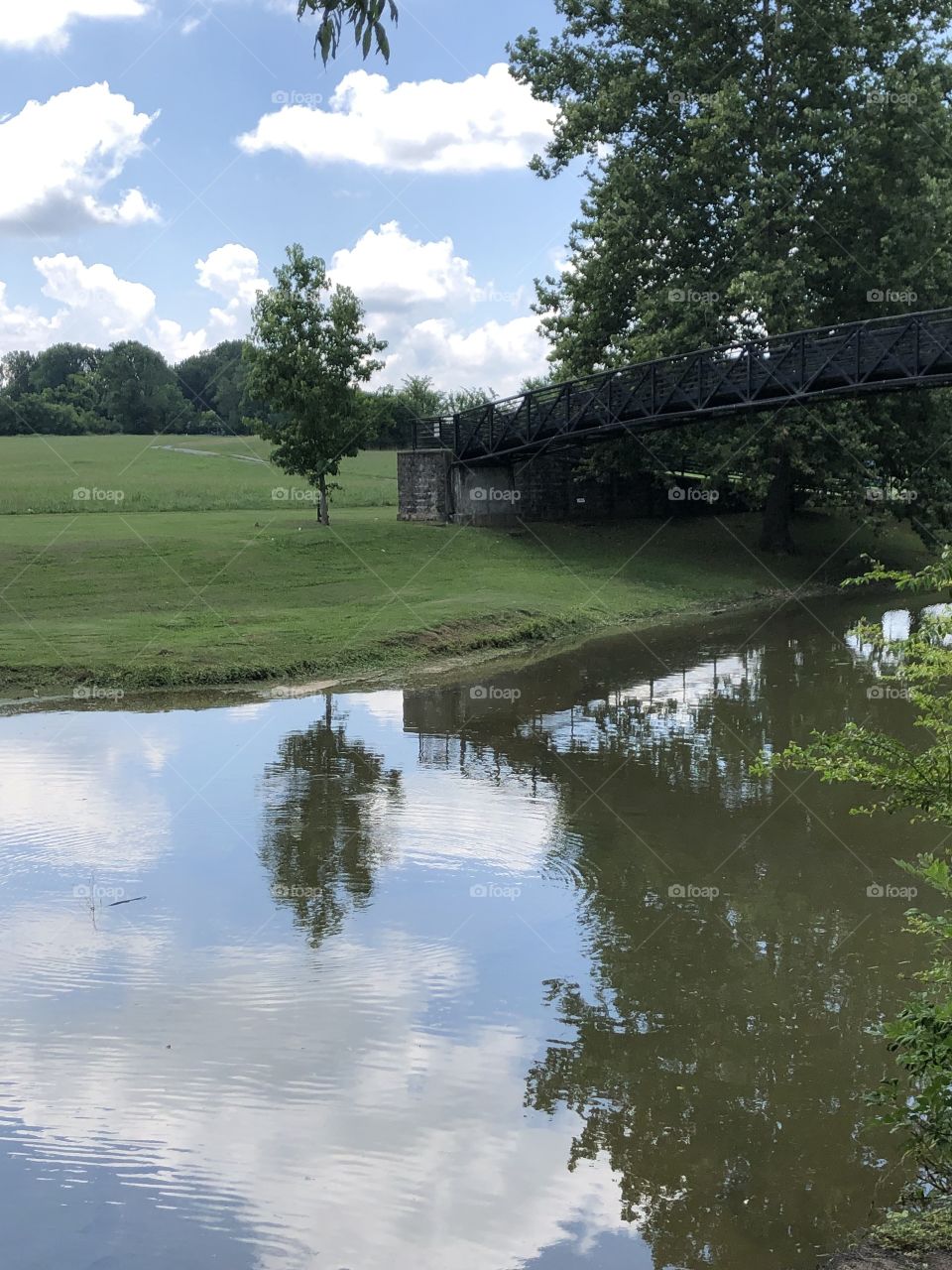 Bridge reflecting in the creek water