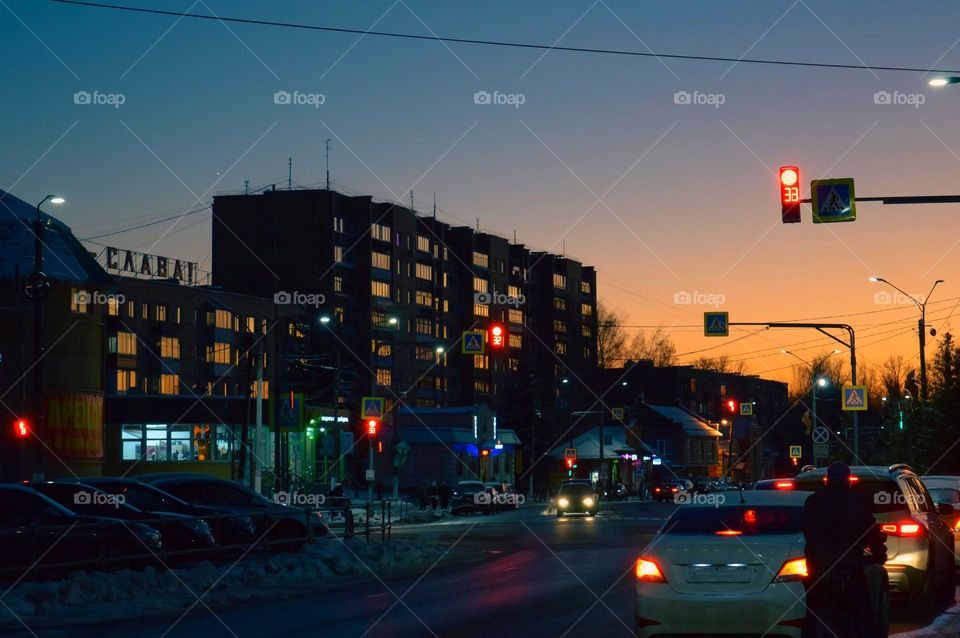 night city with a huge house and light in the windows