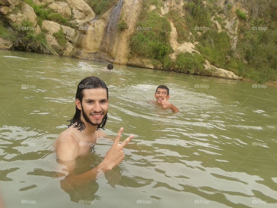 Men taking bath in river