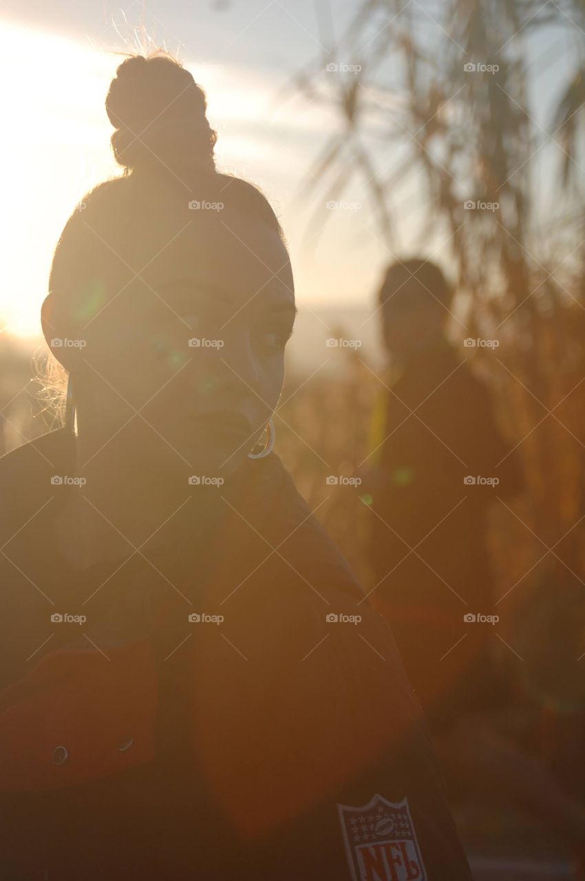 Portrait of a girl against sunset 