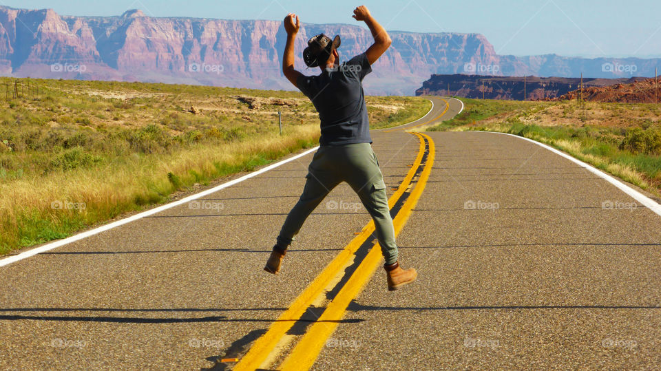 Man jumps on the road