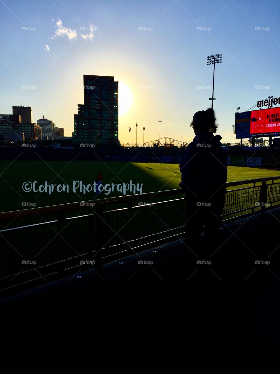 Silhouette of my daughter at the Louisville Bats game. Louisville Slugger Field.