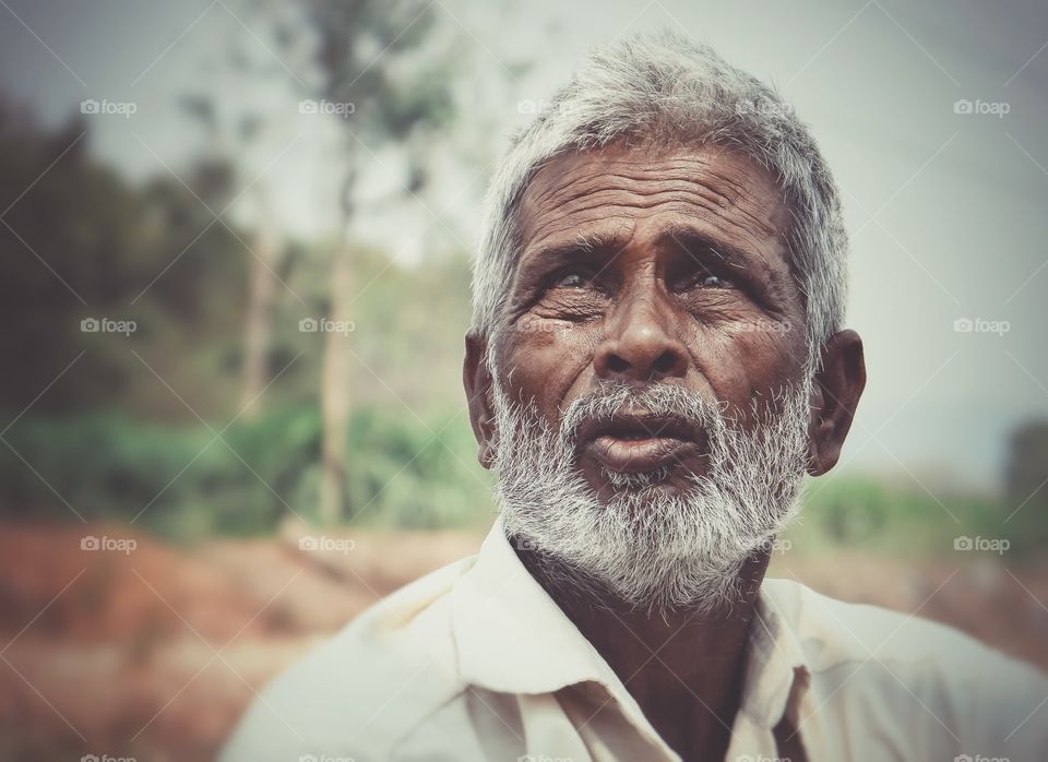 Old indian man looking away