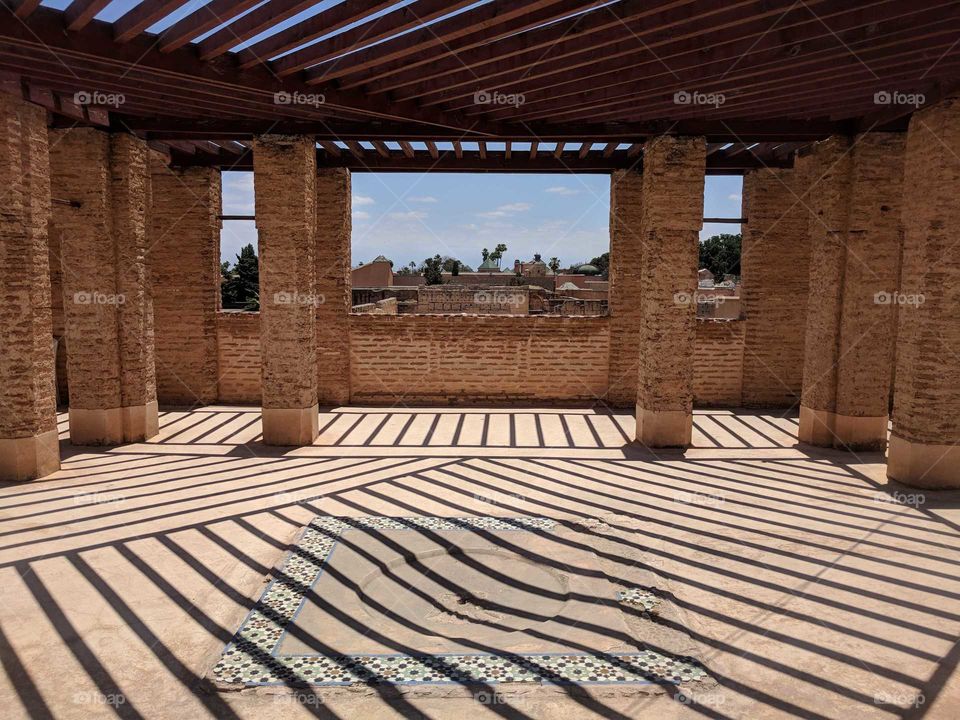 Sun Creating Diagonal Zig Zag Shadow Patterns Through the Roof Slats Across the Roof Floor of Palais El Badi, an Ancient Palace in Marrakech in Morocco